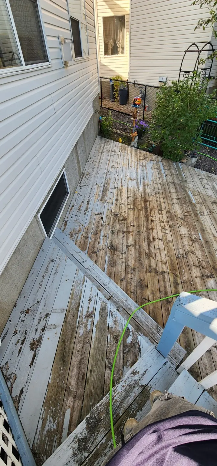 Weathered deck boards before cleaning and sanding in Calgary