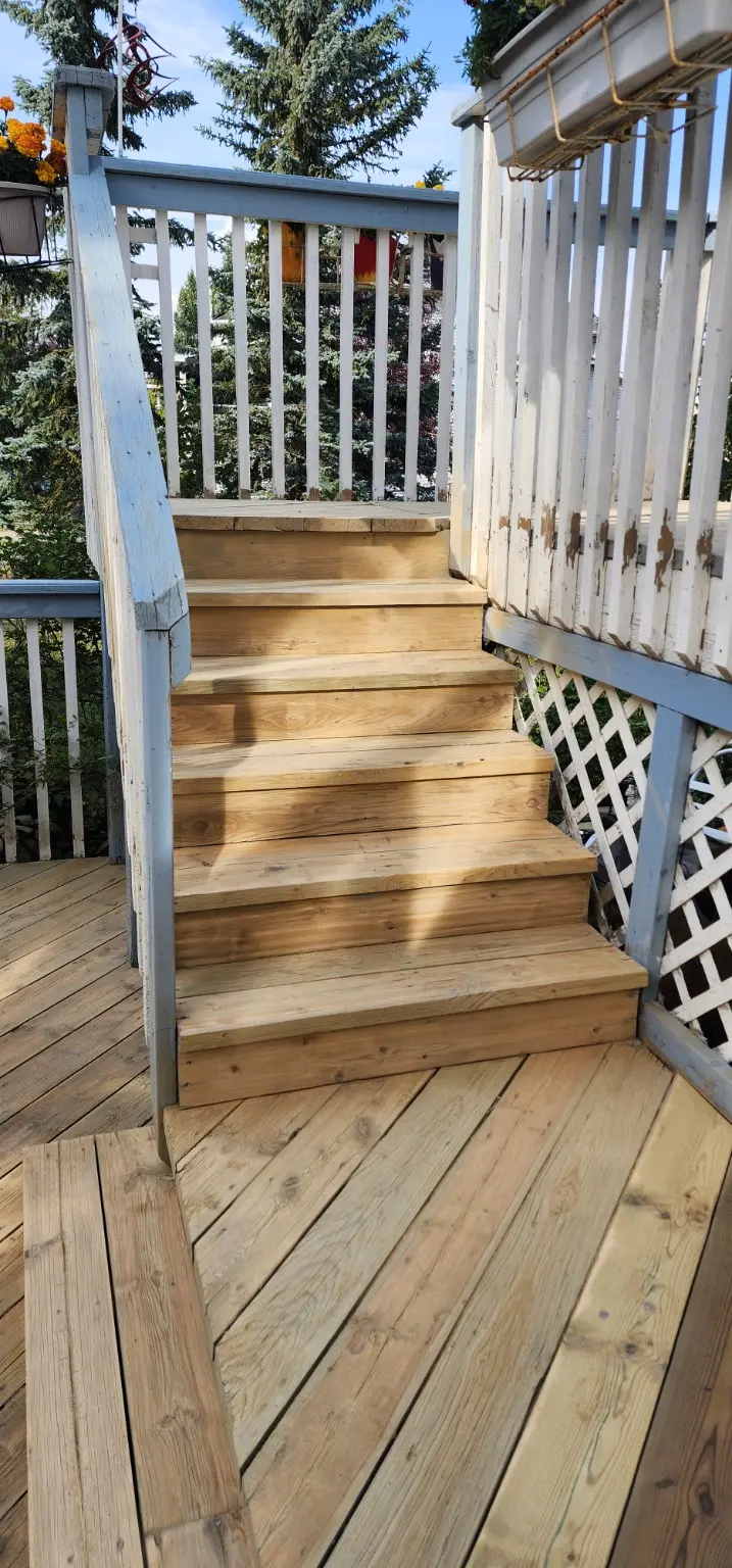 Restored wood deck stairs in Calgary by White5