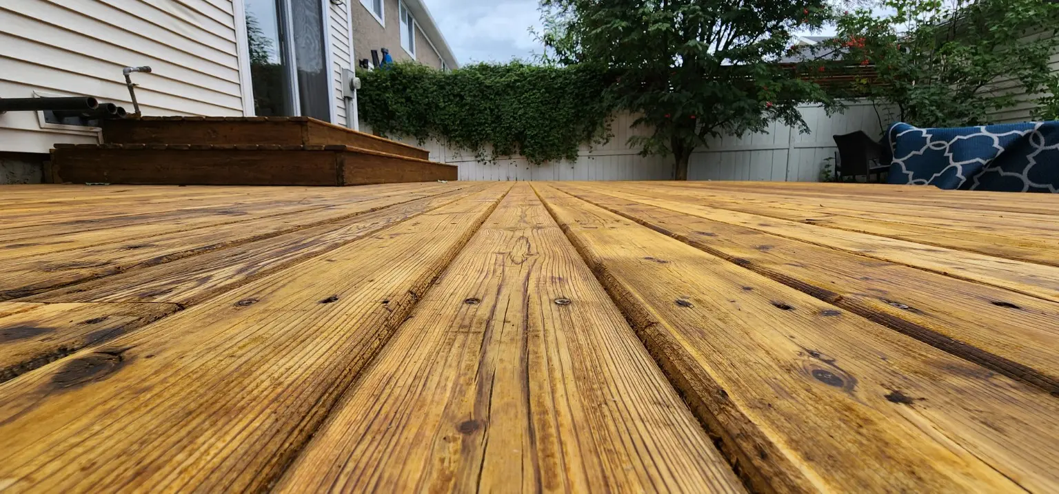 Restored deck boards with a natural wood finish in Calgary
