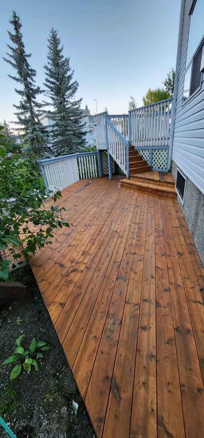 Multi-level wood deck restored by White5 in Calgary